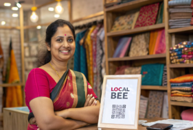 a-cute-shop-and-a-cute-owner-of-a-saree-shop-stand