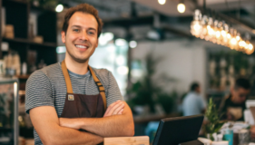 a-cute-shop-and-her-owner-of-a-cafe-standing-behin